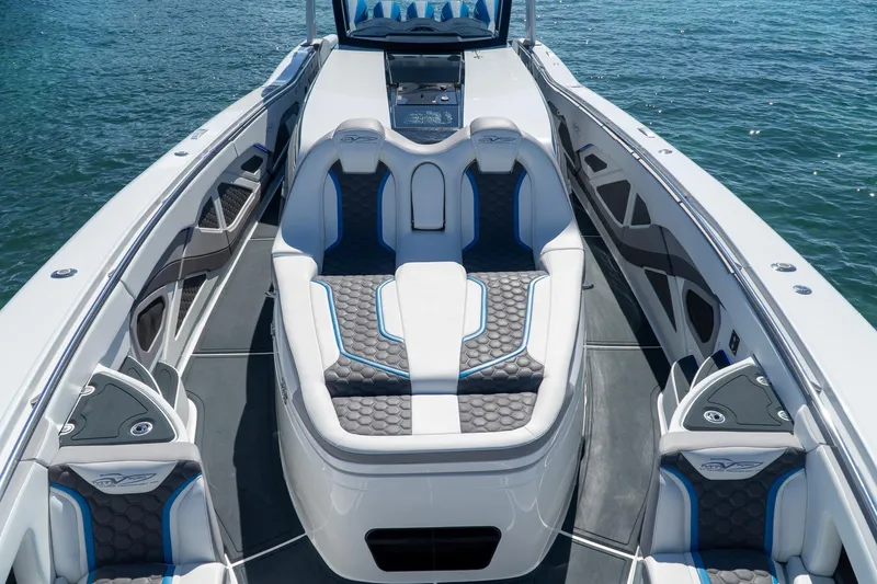  Yacht Photos Pics Luxurious 2023 MTI 50v boat interior with sleek seating and modern design on the water.