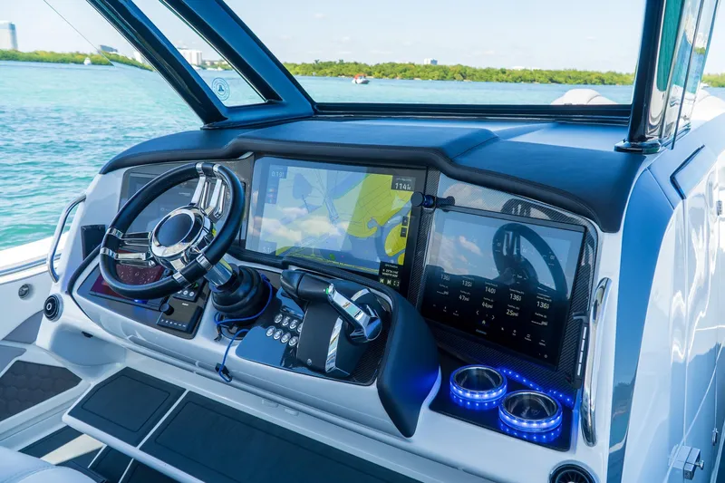  Yacht Photos Pics Dashboard of 2023 MTI 50v boat with navigation screens and steering wheel.