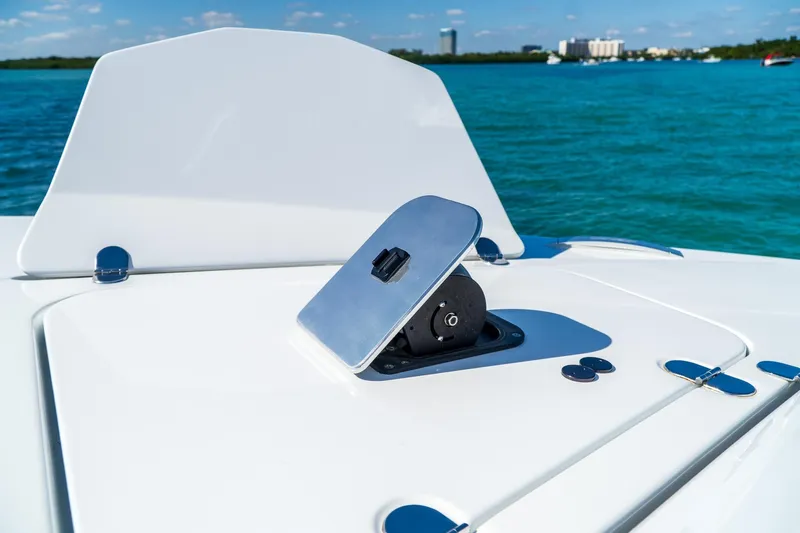  Yacht Photos Pics 2023 MTI 50v boat deck with open hatch, ocean view in background.