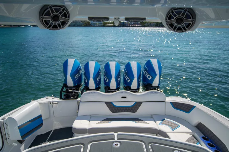  Yacht Photos Pics Luxury MTI 50v boat with five powerful engines, 2023 model, on sparkling blue water.