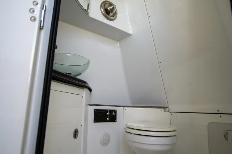  Yacht Photos Pics Modern boat bathroom with glass sink and toilet, MTI 50v, 2023 model.