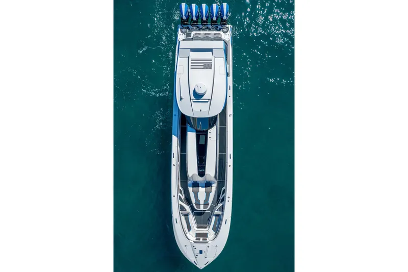  Yacht Photos Pics Aerial view of 2023 MTI 50v boat on clear blue water.