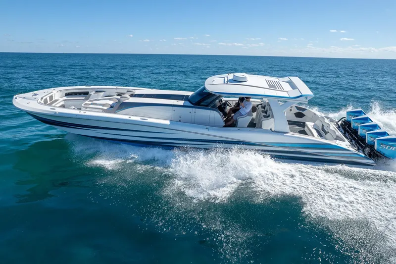  Yacht Photos Pics 2023 MTI 50v boat cruising on open sea with multiple outboard engines.