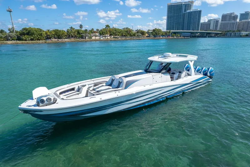  Yacht Photos Pics Luxury MTI 50v boat cruising in clear blue water, 2023 model.