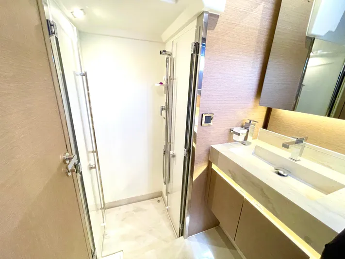 M.y. Blu Dayz Yacht Photos Pics Luxurious bathroom in 2023 Prestige 520 yacht with modern fixtures and elegant design.