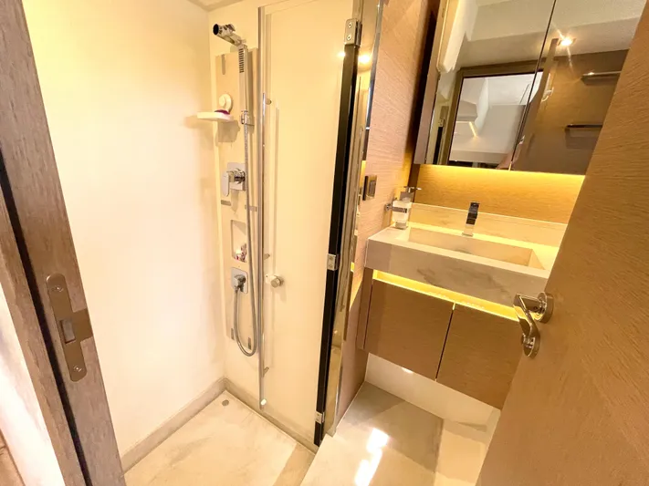 M.y. Blu Dayz Yacht Photos Pics Modern bathroom in 2023 Prestige 520 yacht with shower and illuminated vanity.