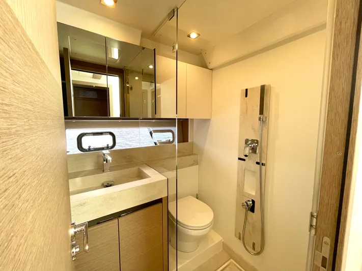 M.y. Blu Dayz Yacht Photos Pics Luxurious bathroom in 2023 Prestige 520 yacht with modern fixtures and elegant design.