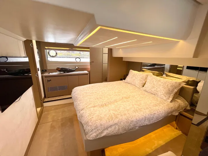 M.y. Blu Dayz Yacht Photos Pics Luxurious bedroom interior of 2023 Prestige 520 yacht with modern design and ambient lighting.