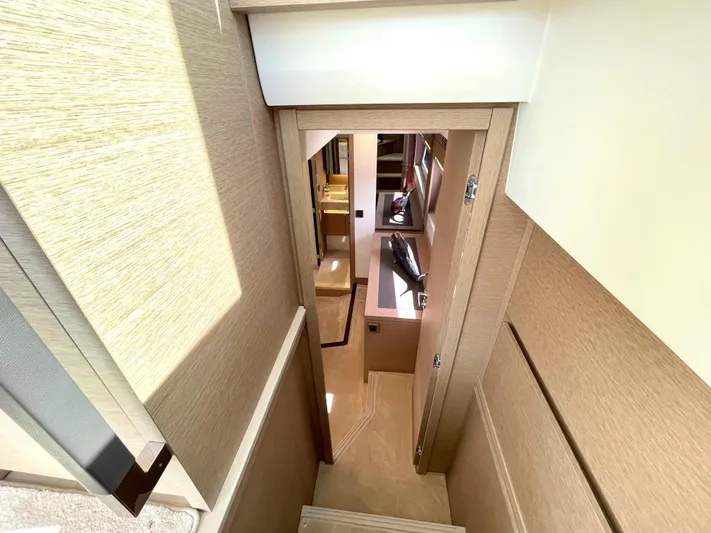 M.y. Blu Dayz Yacht Photos Pics Interior view of 2023 Prestige 520 yacht, showcasing a narrow stairway and modern design.