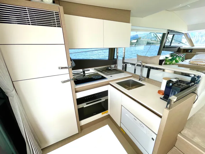 M.y. Blu Dayz Yacht Photos Pics Modern kitchen in 2023 Prestige 520 yacht with sleek cabinetry and appliances.