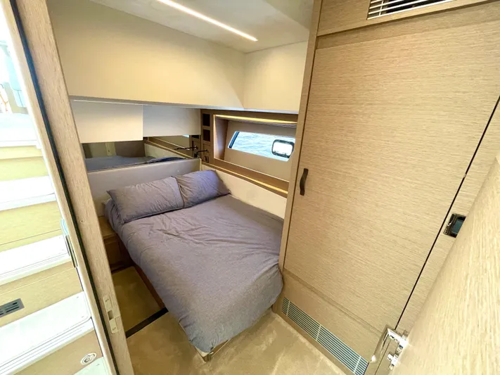 M.y. Blu Dayz Yacht Photos Pics Luxurious cabin interior of 2023 Prestige 520 yacht with cozy bed and modern design.