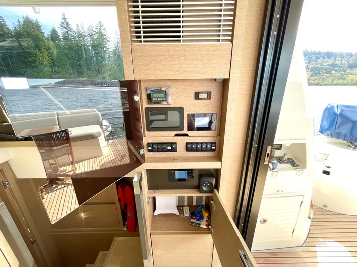 M.y. Blu Dayz Yacht Photos Pics Interior of 2023 Prestige 520 yacht with control panel and scenic water view.