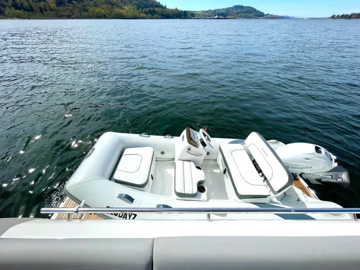 M.y. Blu Dayz Yacht Photos Pics 2023 Prestige 520 boat on serene lake with lush green hills in the background.