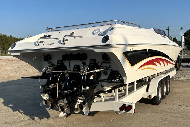  Yacht Photos Pics 2007 Fountain 47 Lightning speedboat on trailer, rear view, showcasing powerful engines and sleek design.