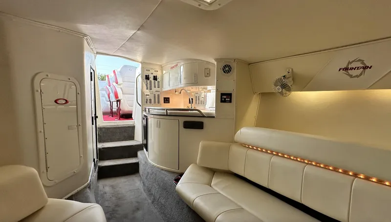  Yacht Photos Pics Luxurious interior of a 2007 Fountain 47 Lightning boat with plush seating and kitchenette.