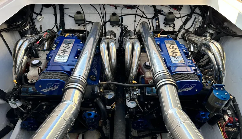  Yacht Photos Pics Twin engines of a 2007 Fountain 47 Lightning boat, showcasing powerful performance components.