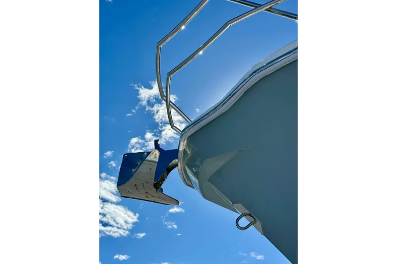  Yacht Photos Pics 2024 NX 360 Sport Coupe boat against a clear blue sky.