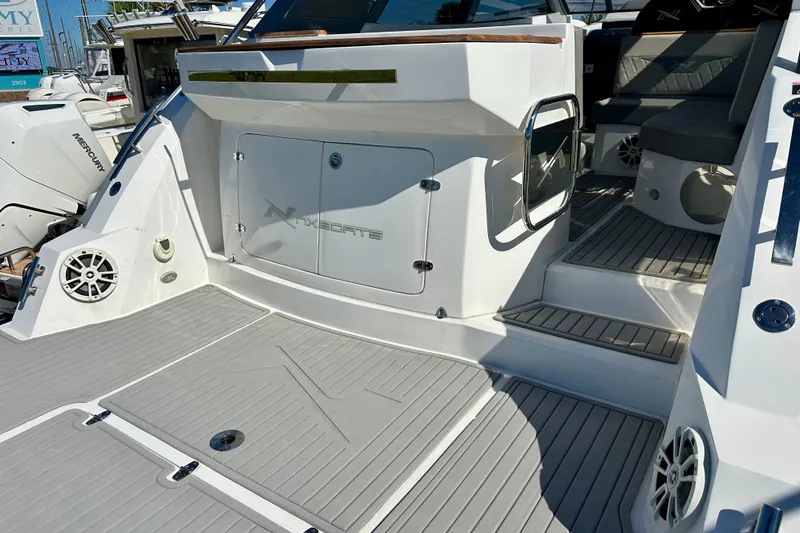  Yacht Photos Pics 2024 NX 360 Sport Coupe boat interior with sleek design and modern features.