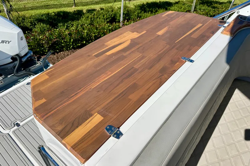  Yacht Photos Pics 2024 NX 360 Sport Coupe boat with wooden deck and Mercury engine.