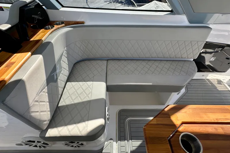  Yacht Photos Pics 2024 NX 360 Sport Coupe interior with elegant seating and wooden accents.