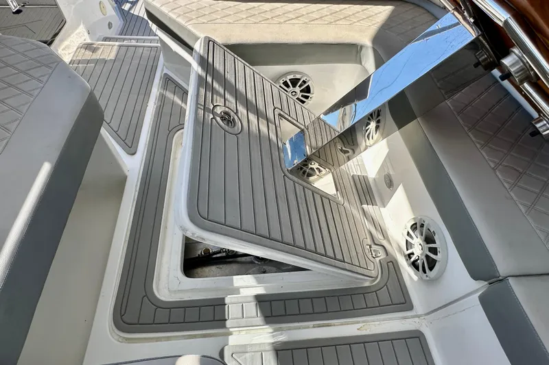  Yacht Photos Pics 2024 NX 360 Sport Coupe interior with open storage compartment and sleek seating.