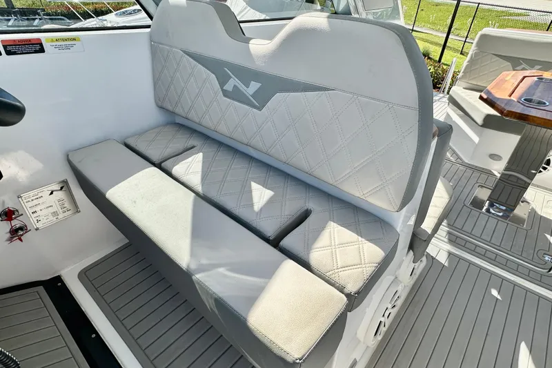  Yacht Photos Pics 2024 NX 360 Sport Coupe interior with diamond-stitched seating and modern design.