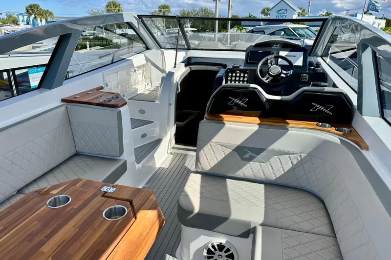  Yacht Photos Pics 2024 NX 360 Sport Coupe interior with luxurious seating and modern dashboard design.