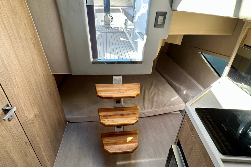  Yacht Photos Pics Interior of 2024 NX 360 Sport Coupe with wooden steps and modern design.