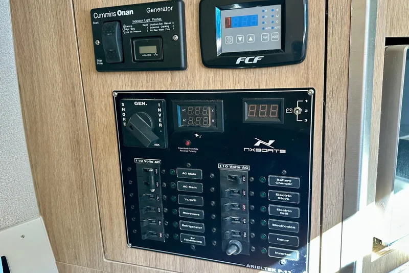  Yacht Photos Pics Electrical control panel in 2024 NX 360 Sport Coupe with generator and inverter switches.