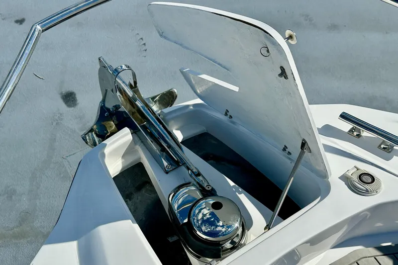  Yacht Photos Pics 2024 NX 360 Sport Coupe anchor compartment with open hatch and polished metal fittings.