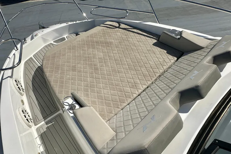  Yacht Photos Pics 2024 NX 360 Sport Coupe boat with spacious sun deck and luxurious seating.