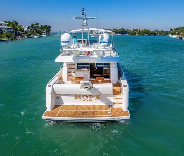 Hope Yacht Photos Pics Ferretti Yachts 660, 2011 model, cruising in clear blue waters.