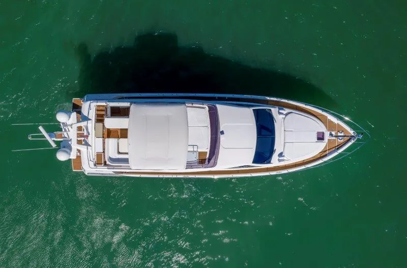 Hope Yacht Photos Pics Aerial view of 2011 Ferretti Yachts 660 on green water.