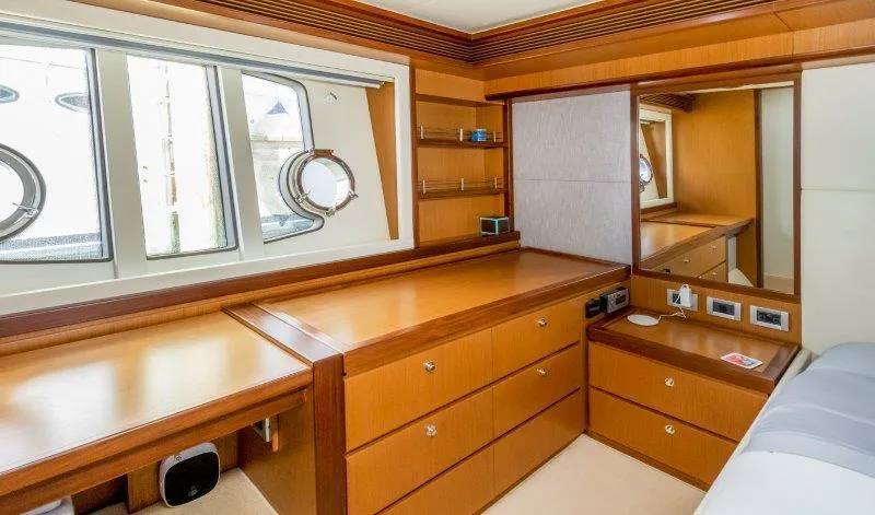 Hope Yacht Photos Pics Luxurious Ferretti Yachts 660 cabin interior with wooden cabinetry and porthole windows, 2011 model.