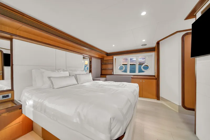 Hope Yacht Photos Pics Luxurious bedroom interior of 2011 Ferretti Yachts 660 with elegant wood accents and ocean view.