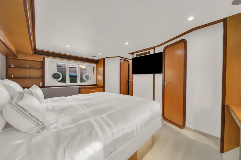 Hope Yacht Photos Pics Luxurious bedroom interior of 2011 Ferretti Yachts 660 with modern design and elegant furnishings.