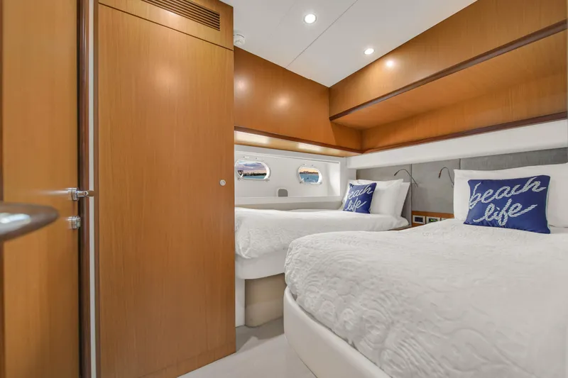 Hope Yacht Photos Pics Luxurious cabin interior of 2011 Ferretti Yachts 660 with twin beds and nautical decor.