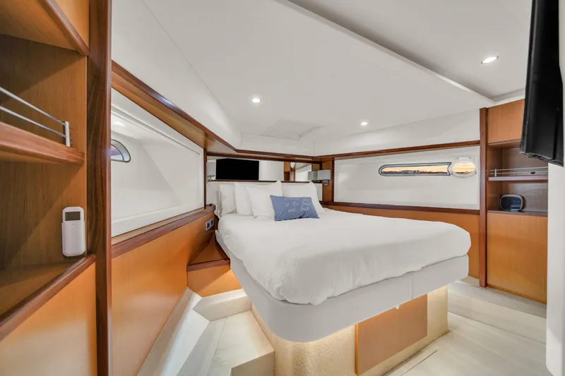 Hope Yacht Photos Pics Luxurious bedroom interior of 2011 Ferretti Yachts 660 with modern design and cozy ambiance.