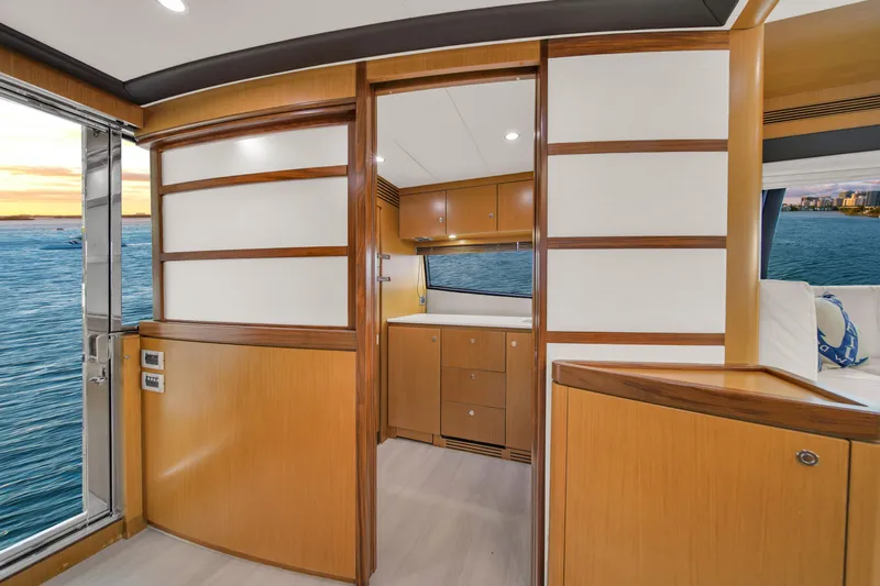 Hope Yacht Photos Pics Luxurious interior of 2011 Ferretti Yachts 660 with wood paneling and ocean view.