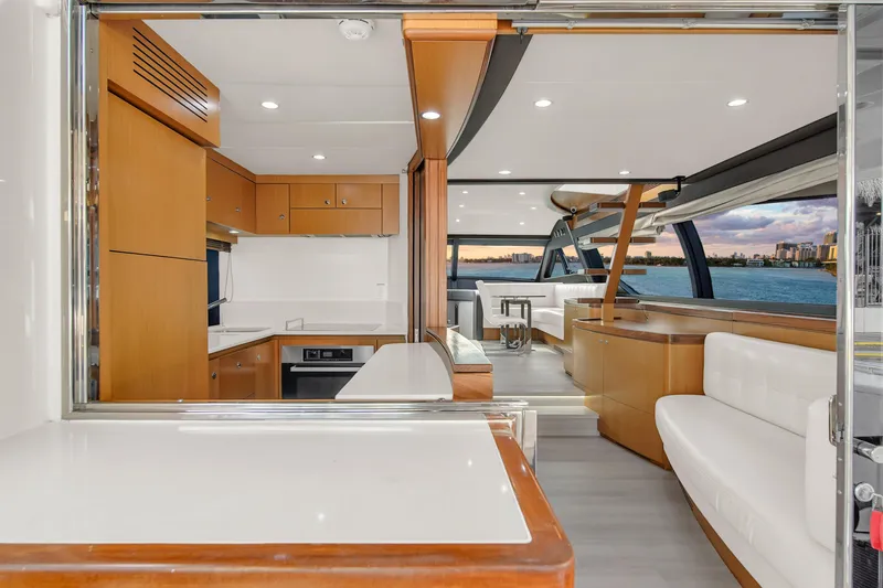 Hope Yacht Photos Pics Luxurious interior of 2011 Ferretti Yachts 660 with modern kitchen and seating area.