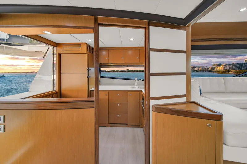 Hope Yacht Photos Pics Luxurious interior of 2011 Ferretti Yachts 660 with wood finishes and ocean view.