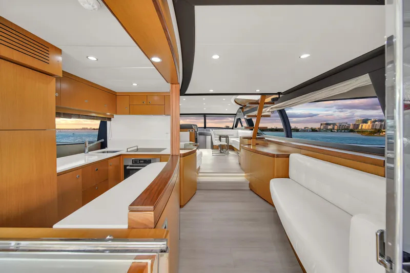 Hope Yacht Photos Pics Luxurious interior of 2011 Ferretti Yachts 660 with modern kitchen and seating area.