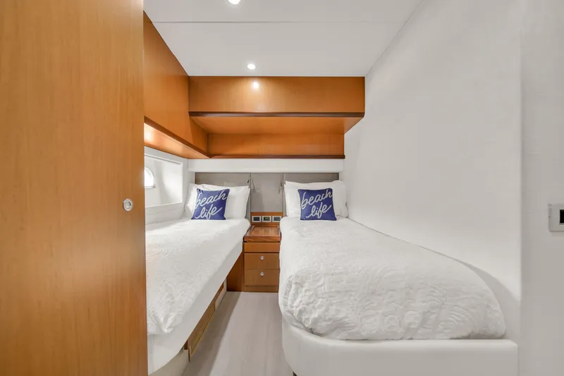 Hope Yacht Photos Pics Luxurious twin cabin in 2011 Ferretti Yachts 660, featuring modern wood accents.