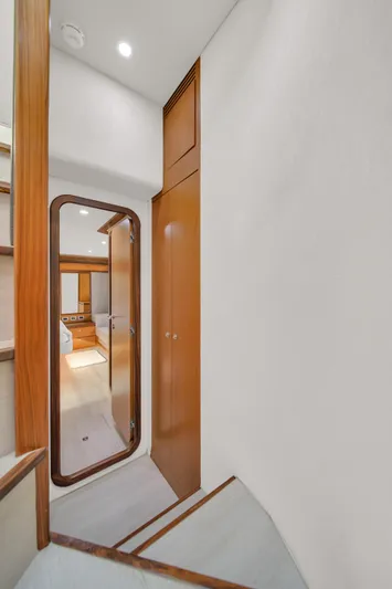 Hope Yacht Photos Pics Interior hallway of 2011 Ferretti Yachts 660, featuring wooden finishes and modern design.