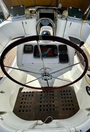 Morning Dance Yacht Photos Pics Steering wheel and control panel of a 2000 Beneteau 461 sailboat.