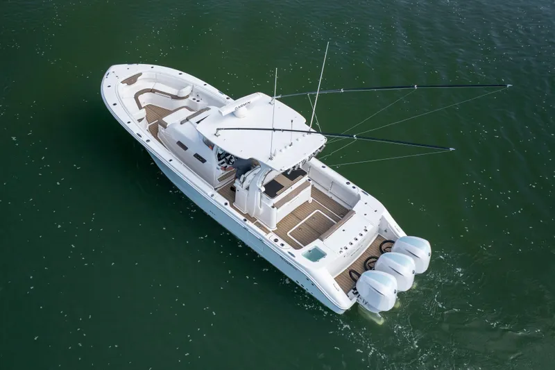 Yacht Photos Pics Aerial view of 2021 Edgewater 370CC boat cruising on water.