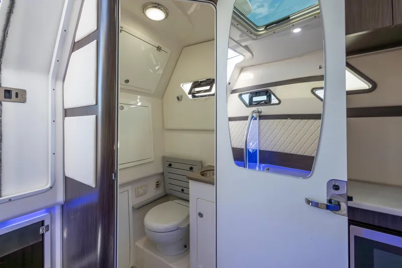  Yacht Photos Pics Luxurious interior of 2021 Edgewater 370CC boat featuring modern bathroom amenities.