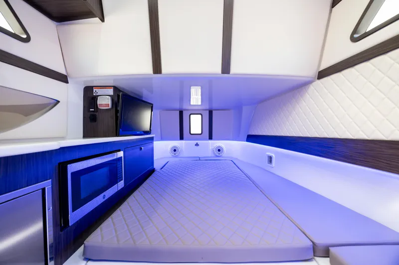  Yacht Photos Pics Luxurious interior of 2021 Edgewater 370CC boat with modern amenities and ambient lighting.