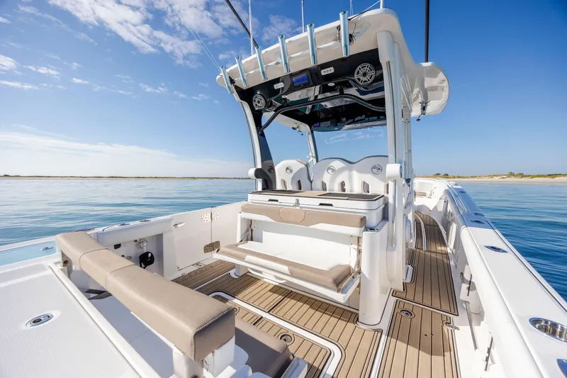  Yacht Photos Pics 2021 Edgewater 370CC boat interior with seating, ocean view, and clear blue sky.