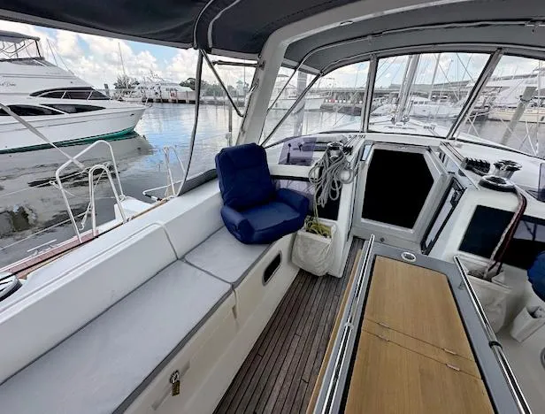Journey Yacht Photos Pics 2019 Beneteau Oceanis 48 yacht interior with seating and marina view.
